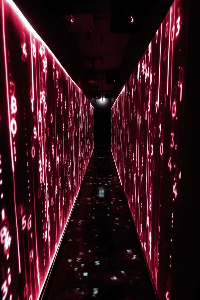 Data-centre corridor lit by red routing signals